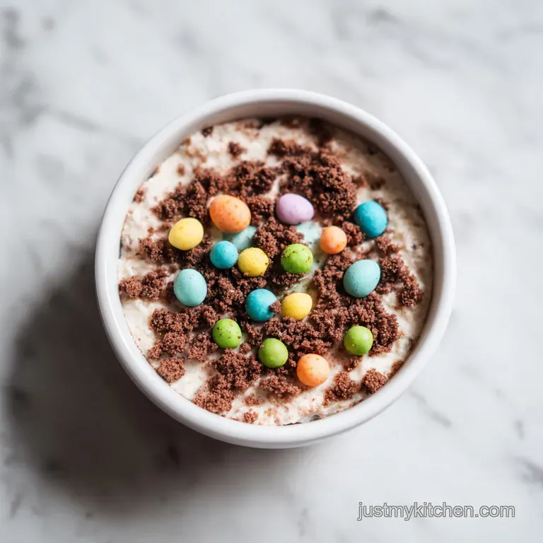 A fork sinks into a rich, chocolatey casserole, revealing creamy layers and colorful candy.