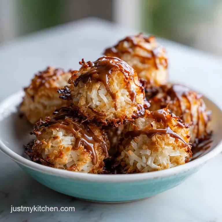 Chewy coconut macaroons with a caramel drizzle, artfully arranged on a white plate with a fork.